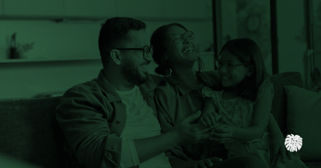A traditional Hispanic family smiling.